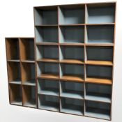 Four 20th century pine and teak veneered stackable open bookshelves, each 140 cm x 65 cm x 35 cm.