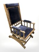 An early 20th century beech rocking chair