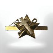 A 9ct gold Masonic brooch decorated with a five-point star, crucifix and shepherd's crook,