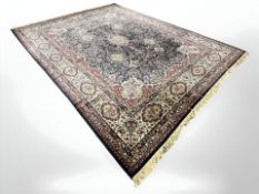 A machine made carpet of Iranian Kirman design, 417 cm x 300 cm.