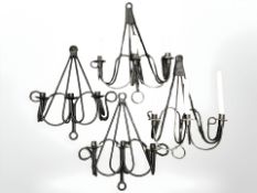 Four wrought iron three branch candle scones (one box)