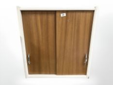 A Scandinavian painted pine sliding door cabinet, width 60 cm.