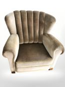 An Art Deco armchair in olive fabric,