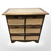 A wicker six drawer chest, 84 cm x 46 cm x 83 cm.