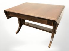 A continental inlaid mahogany drop leaf library table, unextended 112 cm long.