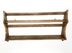 An Ercol stained elm plate rack,