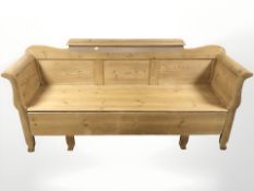 A 19th century pine box settle, 201 cm x 55 cm x 94 cm.