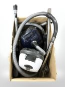 A Meile vacuum cleaner and a Bosch vacuum with continental plugs