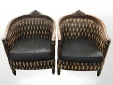 A pair of wooden framed wicker armchairs