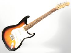 A Stratocaster style electric guitar CONDITION REPORT: Body showing scuffs,