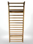 A Swedish pine wall ladder, 80 cm x 14 cm x 220 cm.