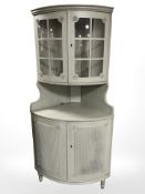 A reproduction painted corner cabinet, height 178 cm.