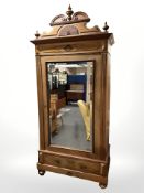A 19th century French walnut mirror door wardrobe,