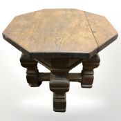 A 19th century oak octagonal low table, width 70 cm.