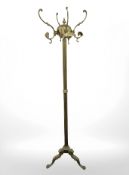 An ornate brass hat and coat stand, height 170 cm.