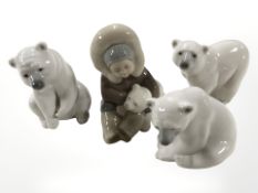 A Lladro inuit and polar bear cub and three further polar bears, tallest 12 cm.