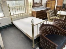 An early 20th century brass 5' bed frame with mattress base