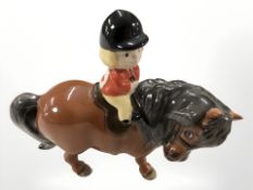 A John Beswick figure of a boy on a pony, height 11 cm.