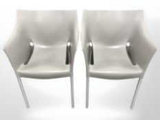 A pair of Italian Kartell plastic chairs.