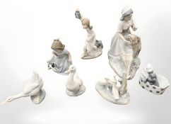 Seven Nao figures and groups, tallest 23cm.