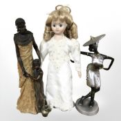 An Alberon porcelain headed doll on stand, resin figure of an African mother and child,