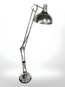 A contemporary chrome plated angle poised floor lamp