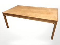 A Danish teak rectangular coffee table, length 137 cm, and two pine tables.