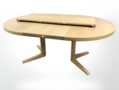 A contemporary Danish oak extending dining table with two leaves, total length 220 cm.