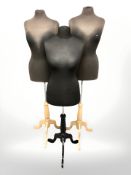 Three female mannequins on stands.