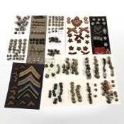 A good collection of over 340 Victorian and later British Army brass buttons and cap badges,