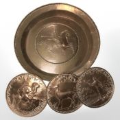 A 19th century embossed copper charger depicting a soldier on horseback, diameter 41 cm,