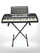 A Yamaha PSR-280 digital keyboard, on stand.