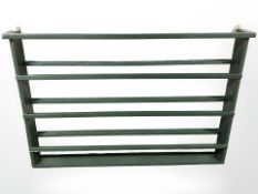 A painted plate rack, width 138 cm.