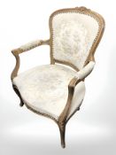 A continental beech tapestry armchair.