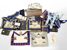 A collection of Masonic regalia, including two silver medals and other examples.