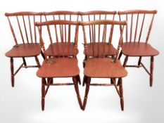A set of six stained beech spindle back kitchen chairs.