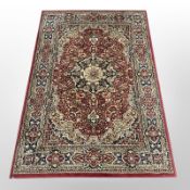 A machine made rug of Iranian design, 191 cm x 135 cm.