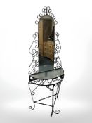 A wrought metal mirror back hall table,