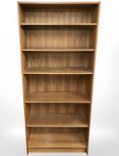 A teak veneered open bookcase,
