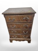 A reproduction mahogany four drawer low chest,