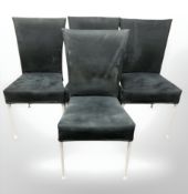 A set of four contemporary metal framed dining chairs.