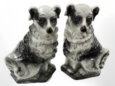 A pair of gilt ceramic fireside dog ornaments,