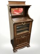 A late Victorian mahogany and satinwood inlaid music cabinet, 50 cm x 41 cm x 117 cm.