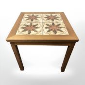 A Danish teak tile inset lamp table, width 51 cm.