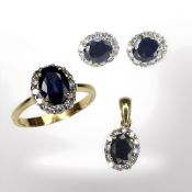 An 18ct gold sapphire and diamond cluster ring with matching pendant on pair of earrings ensuite,