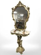 A reproduction gilt plaster and onyx topped console table with figural support and matching mirror