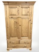 A modern pine double door wardrobe,