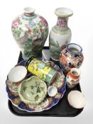 A group of 20th century Chinese and Japanese export porcelain and earthen ware vases, charger,