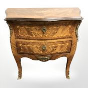 A continental kingwood and satinwood veneered serpentine two drawer chest, 81 cm x 42 cm x 70 cm.