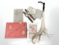 A British Army crest album with partially filled contents,